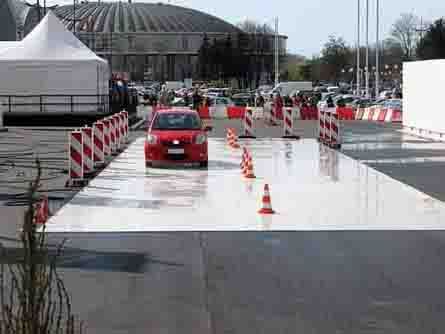 A student drives a car on a testing track